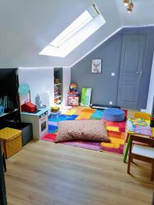 a room with a bed in the middle of a room at Belle maison conviviale in Coulommiers +37 photos