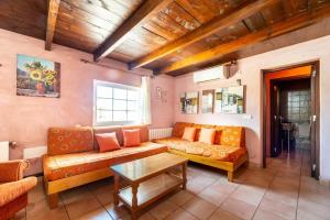a living room with a couch and a table at Casa 2 Hermanas Formentera in Illes Balears