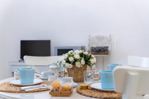 TV a/nebo společenská místnost v ubytování Appartamento Achates