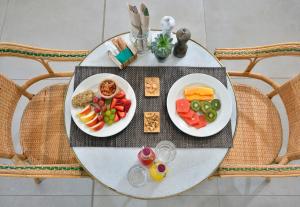 a table with two plates of food on it at INNSiDE by Meliá Fuerteventura – Adults Only in Costa Calma
