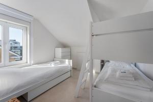 Ένα ή περισσότερα κρεβάτια σε δωμάτιο στο Stijlvol design app - eindeloos uitzicht op groen!