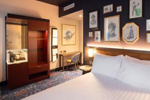 Ένα ή περισσότερα κρεβάτια σε δωμάτιο στο The Mercantile Hotel