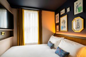 Ένα ή περισσότερα κρεβάτια σε δωμάτιο στο The Mercantile Hotel