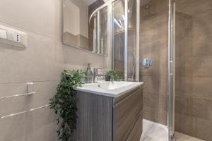 a bathroom with a sink and a shower at Via Santa Croce 1 in Milan +45 photos