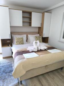 a bedroom with a large bed with towels on it at Skyrock in Tučepi +43 photos