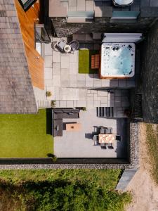 an overhead view of a house with a swimming pool at Midways, Stunning Retreat in the Heart of Bowness in Bowness-on-Windermere
