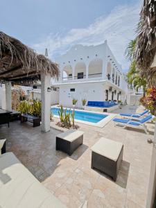 a large white house with a swimming pool at CASA VACACIONAL TANiA in Salinas