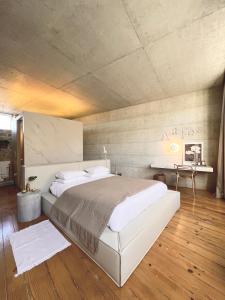 a bedroom with a large bed in a room at Element in Viseu