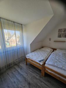 Postel nebo postele na pokoji v ubytování Ferienwohnung Ausblick