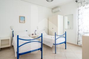 Postelja oz. postelje v sobi nastanitve Homiday - Via Gramsci Azzurro