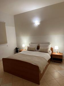 Postel nebo postele na pokoji v ubytování Apartmani Funtana