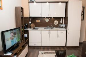 Η κουζίνα ή μικρή κουζίνα στο Apartment in Amphora Palace Aparthotel +22 φωτογραφίες