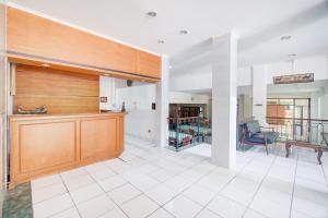 a large lobby with a bench and a table at Dancenter Bogor near Taman Safari formerly Hotel Rudian 1 in Brujul