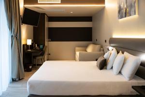 Postel nebo postele na pokoji v ubytování Vision Hotel