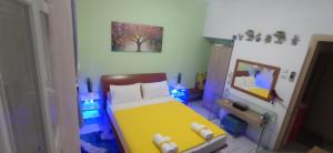 A bed or beds in a room at KIKI APARTMENT