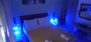 A bed or beds in a room at KIKI APARTMENT