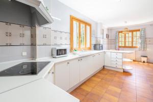 A kitchen or kitchenette at Villa d'Es Trenc