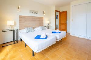 A bed or beds in a room at Villa d'Es Trenc