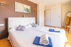 A bed or beds in a room at Villa d'Es Trenc