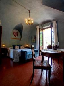 Łóżko lub łóżka w pokoju w obiekcie La Casa Rosa