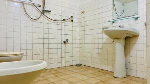 a bathroom with a sink and a toilet at The Old Manor - Weligama in Weligama +46 photos