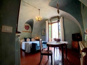 Łóżko lub łóżka w pokoju w obiekcie La Casa Rosa