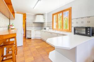 A kitchen or kitchenette at Villa d'Es Trenc