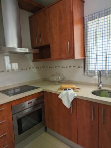 Kuchyň nebo kuchyňský kout v ubytování Apartamento Servic