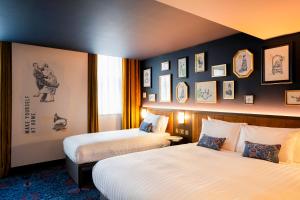 Ένα ή περισσότερα κρεβάτια σε δωμάτιο στο The Mercantile Hotel