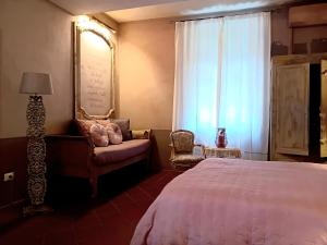 Łóżko lub łóżka w pokoju w obiekcie La Casa Rosa