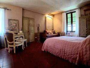 Łóżko lub łóżka w pokoju w obiekcie La Casa Rosa