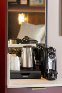 a coffee maker sitting on top of a shelf at The Mercantile Hotel in Dublin