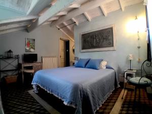 Łóżko lub łóżka w pokoju w obiekcie La Casa Rosa