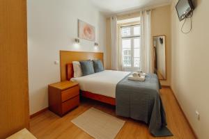 Rossio Suites By Hosty客房内的一张或多张床位