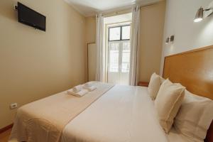 Rossio Suites By Hosty客房内的一张或多张床位