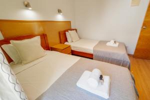 Rossio Suites By Hosty客房内的一张或多张床位