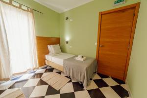 Rossio Suites By Hosty客房内的一张或多张床位