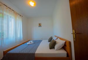 Ένα ή περισσότερα κρεβάτια σε δωμάτιο στο Apartman Leon