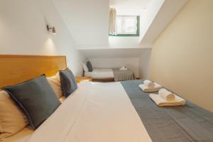 Rossio Suites By Hosty客房内的一张或多张床位