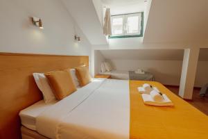 Rossio Suites By Hosty客房内的一张或多张床位