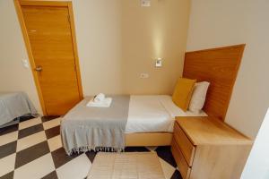 Rossio Suites By Hosty客房内的一张或多张床位