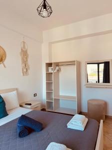 a bedroom with a large bed and a window at Villa White in Ksamil +37 photos