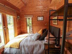 Postel nebo postele na pokoji v ubytování Snape Castle Garden Lodge