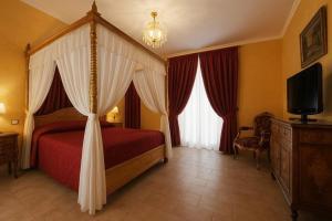 Voodi või voodid majutusasutuse Grand Hotel Vigna Nocelli toas