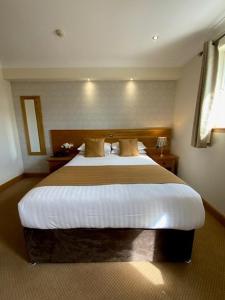 Postel nebo postele na pokoji v ubytování Victoria Hotel