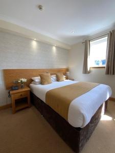 Postel nebo postele na pokoji v ubytování Victoria Hotel