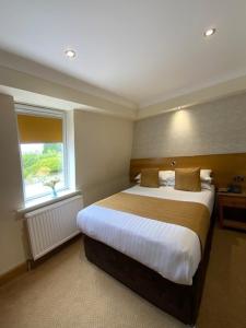 Postel nebo postele na pokoji v ubytování Victoria Hotel