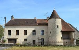 an old stone house with a roof at 2 CHAMBRES DANS MAISON EN PIERRE ATYPIQUe in Lœuilley