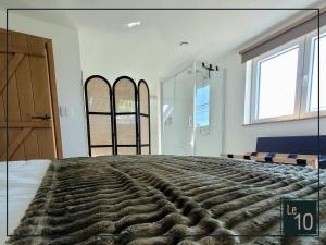 Posteľ alebo postele v izbe v ubytovaní Le 10 - Gîte 6 personnes dans le Condroz