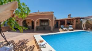 a house with a swimming pool in front of a house at Villa Ortega Alba Alcalá La Real by Ruralidays in Alcalá la Real